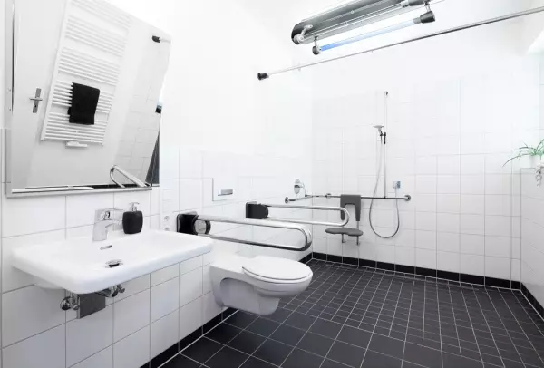 Automatic disinfection of wet rooms in patient rooms
